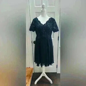 JJ’s House dk blue dress, short sleeves, sequence top, zipper back, tier length.